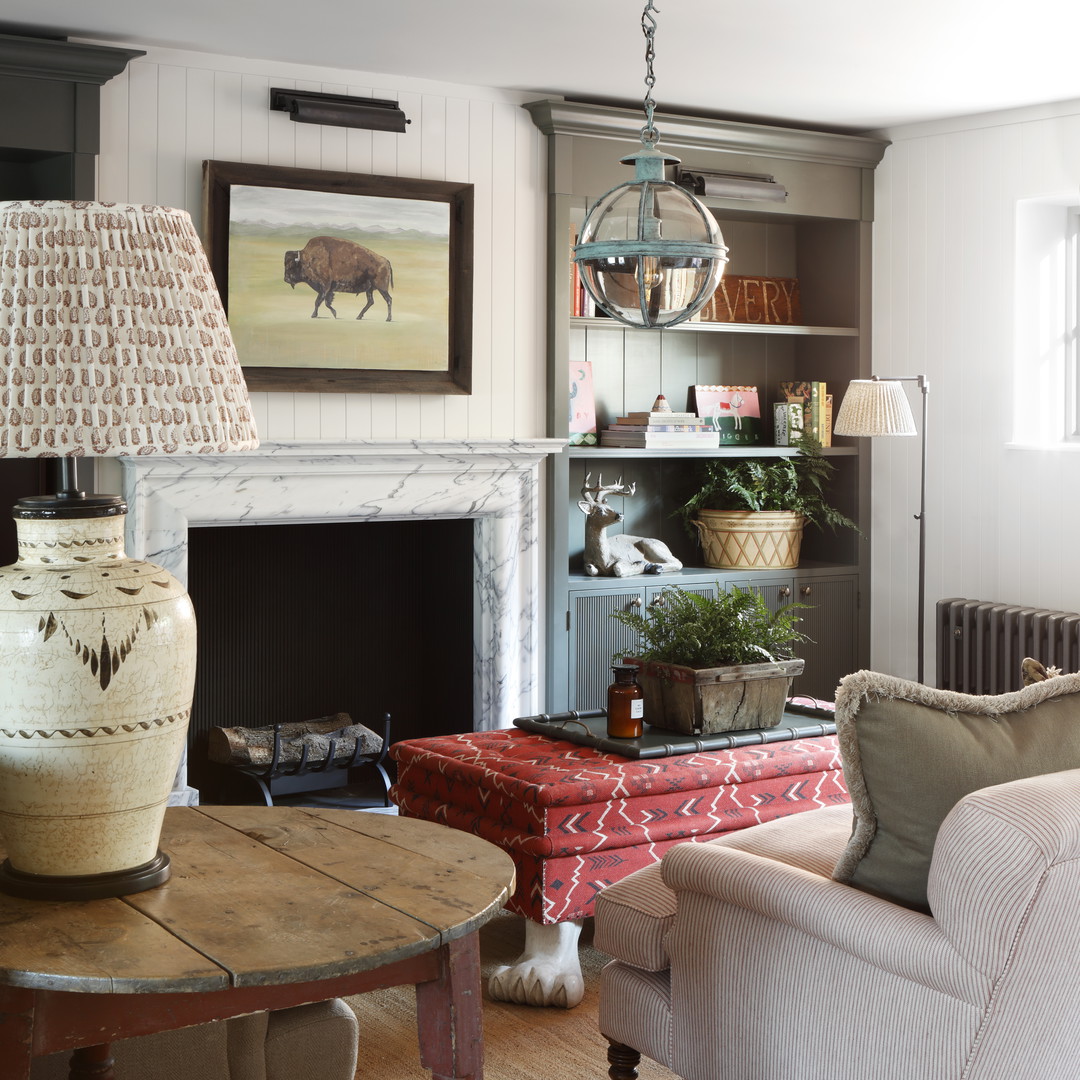 a living room filled with furniture and a fire place