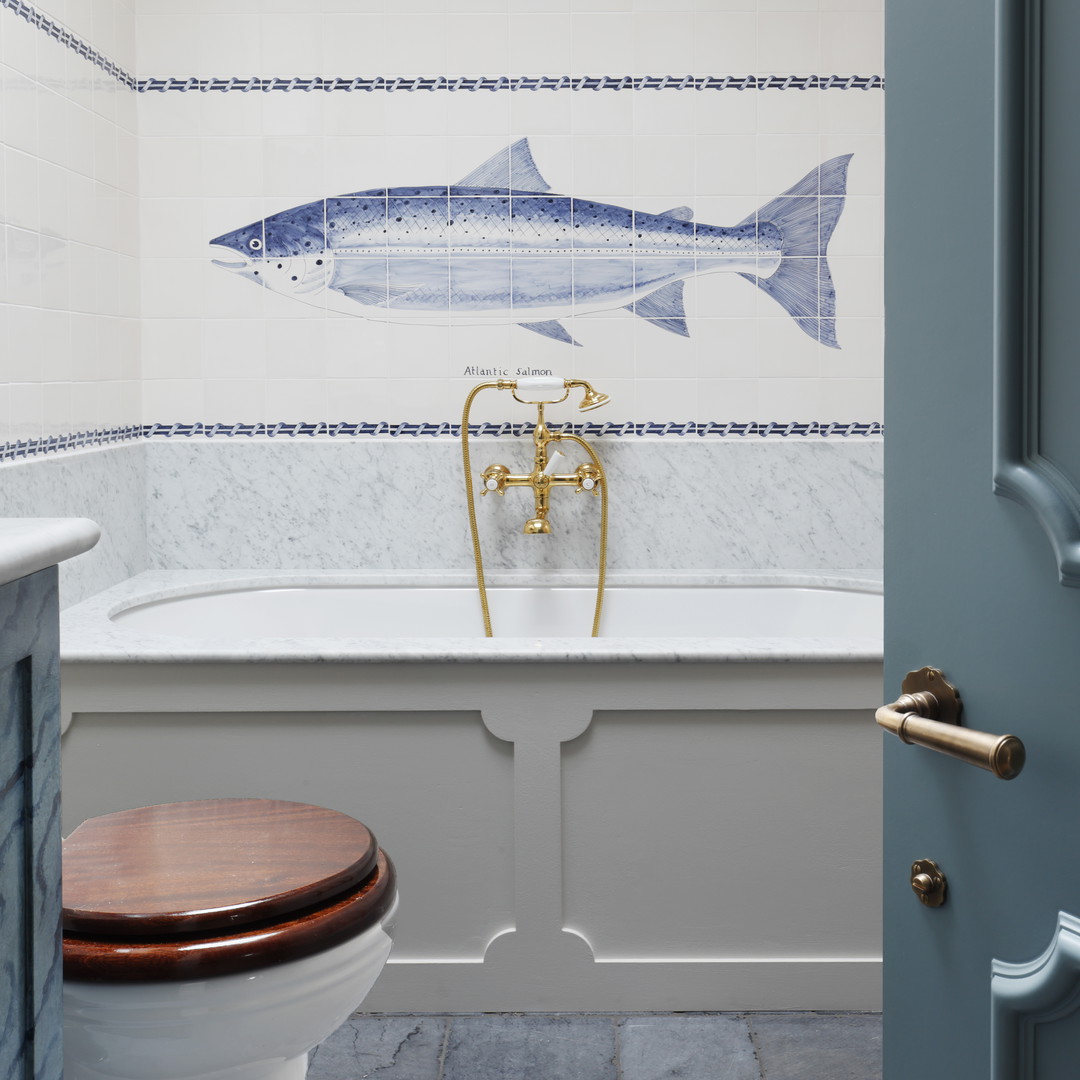 a bathroom with a fish mural on the wall