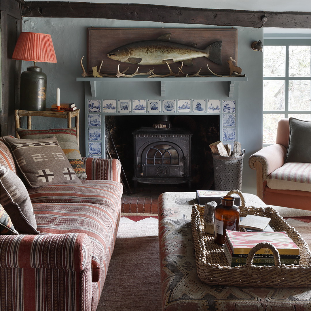 a living room filled with furniture and a fire place