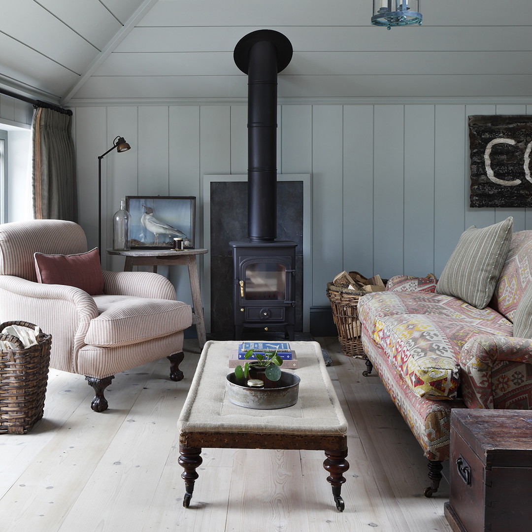 a living room filled with furniture and a fire place