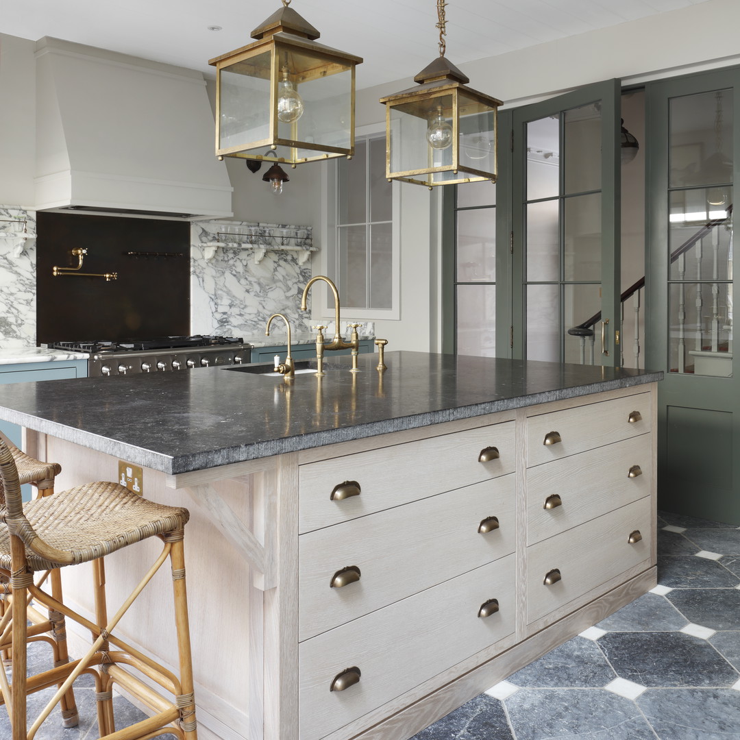 a kitchen with a marble counter top and island