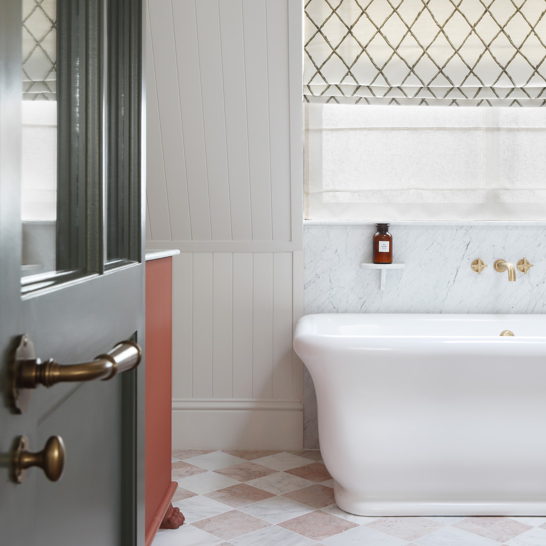 a white bath tub sitting next to a window