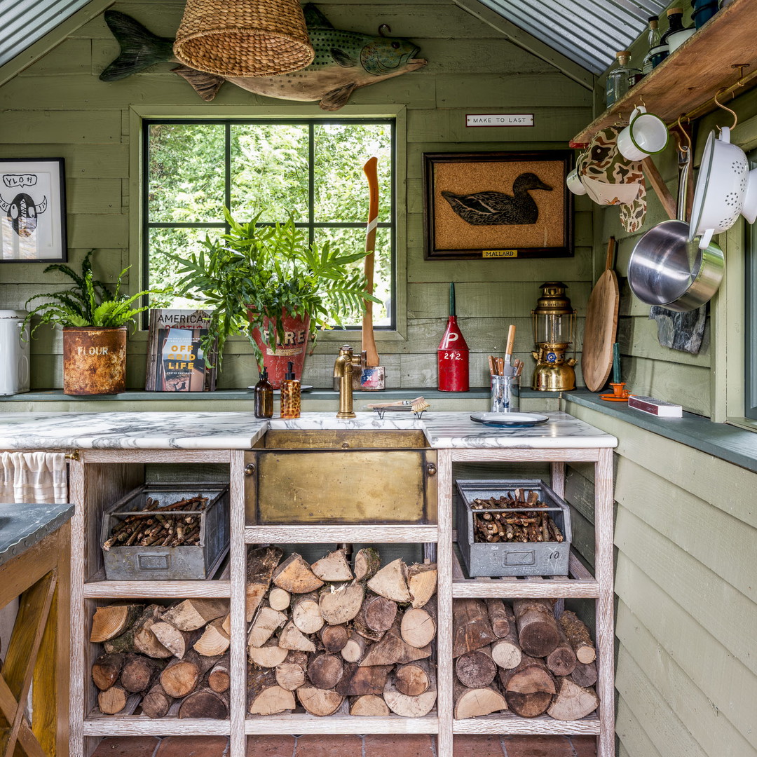 a kitchen filled with lots of wood stacked on top of each other