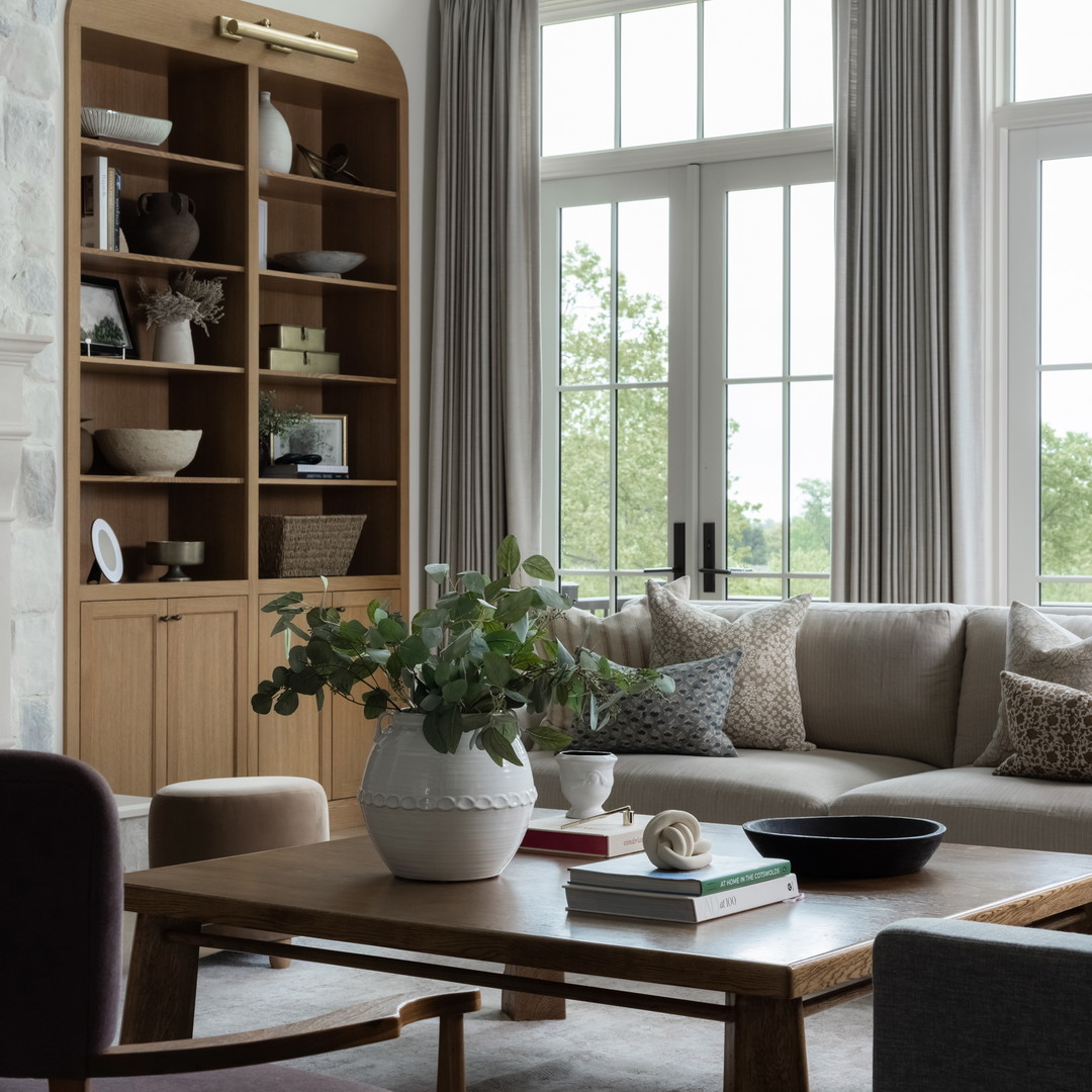 a living room filled with furniture and a fire place