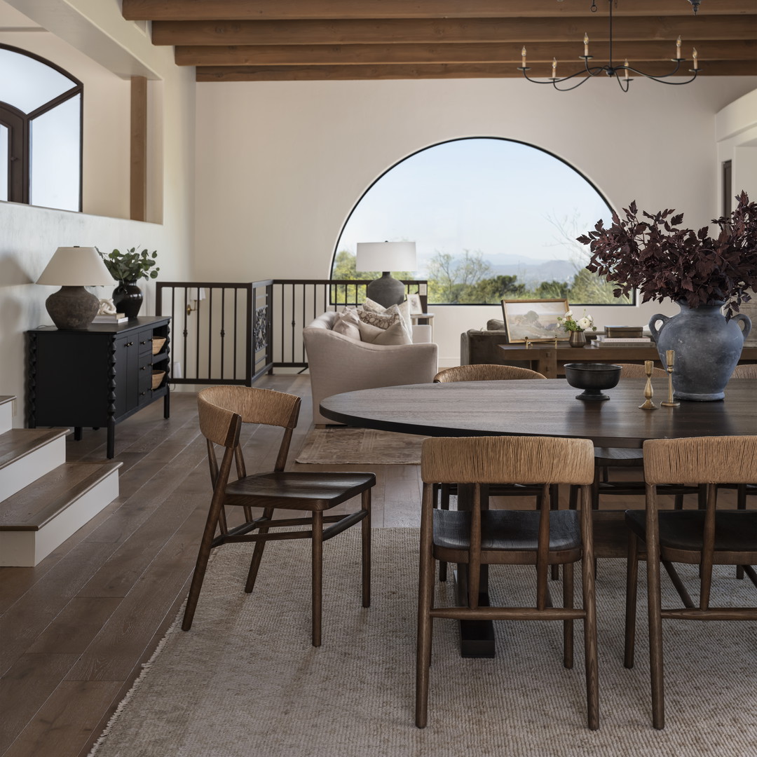 a dining room with a table and chairs