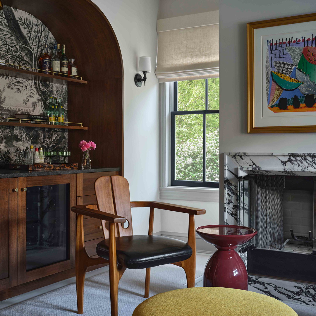 a living room filled with furniture and a fire place