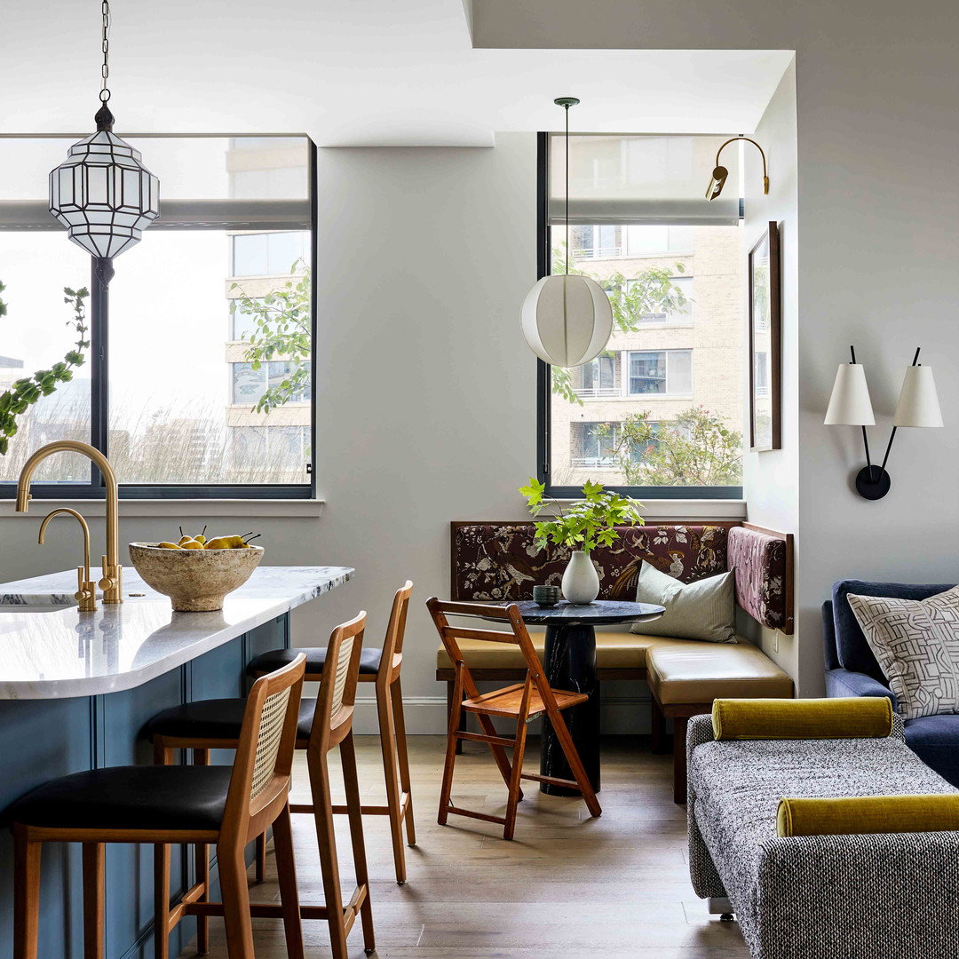 a living room with a couch a table and chairs