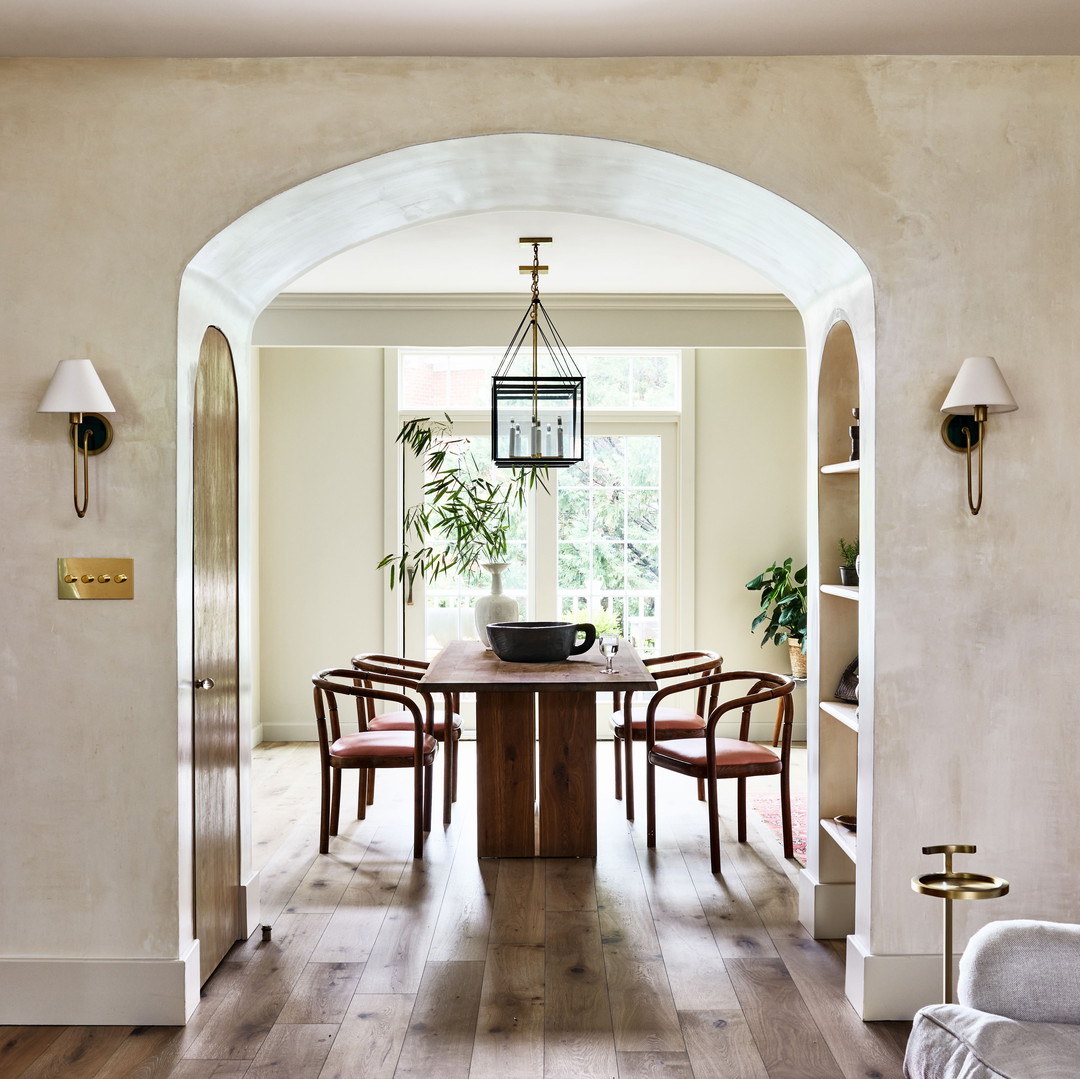 a dining room with a table and chairs