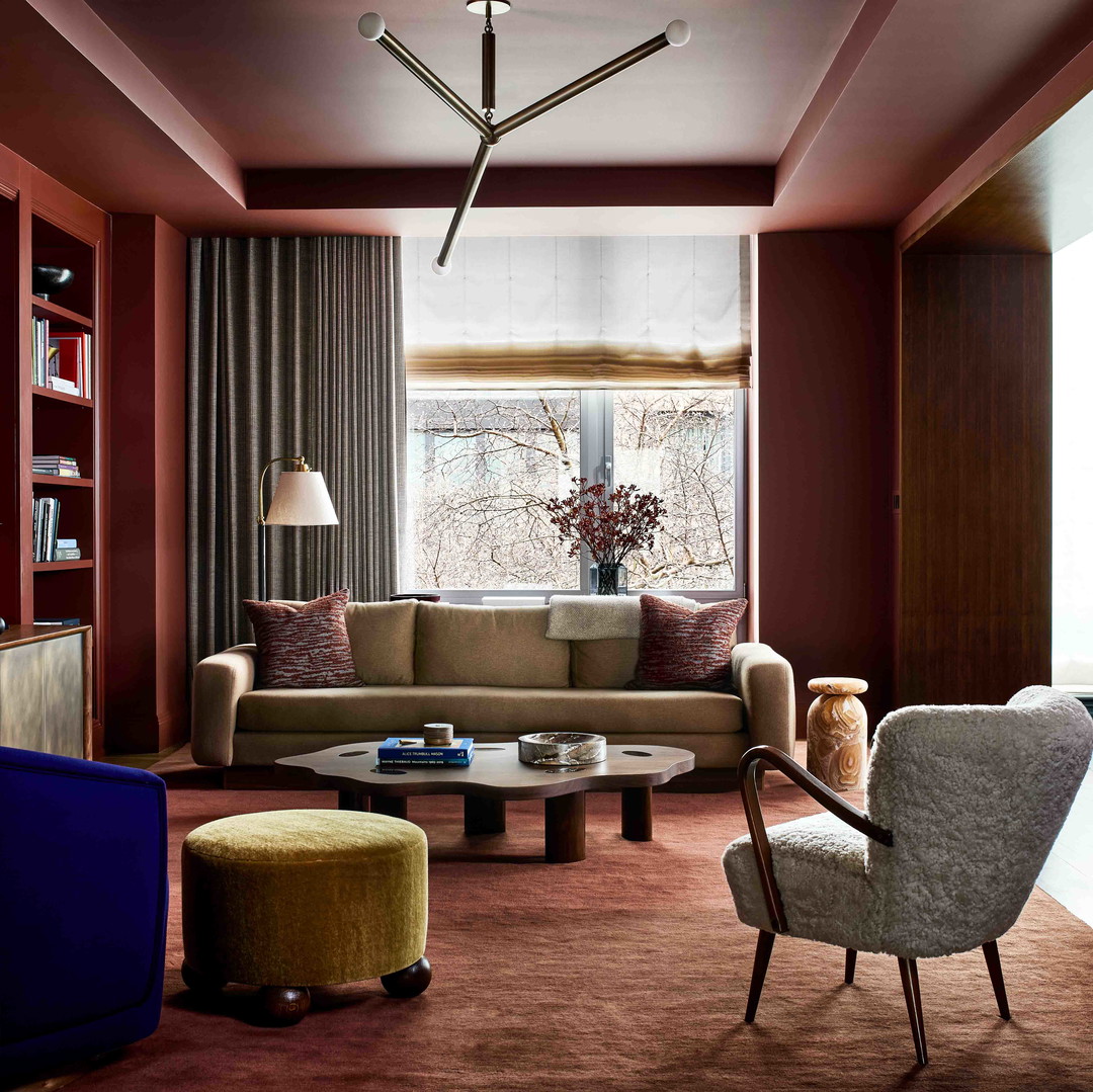 a living room filled with furniture and a flat screen tv