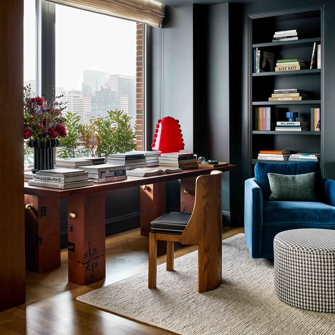 a living room filled with furniture and a large window