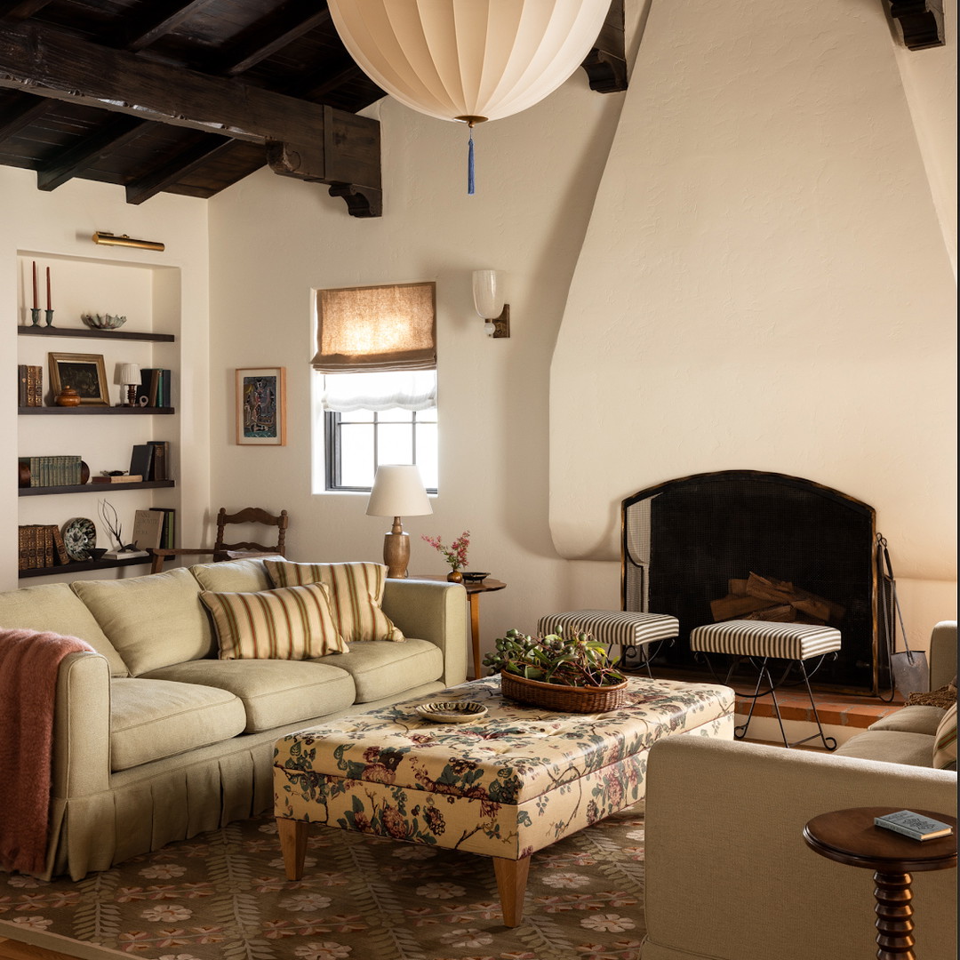 a living room filled with furniture and a fire place