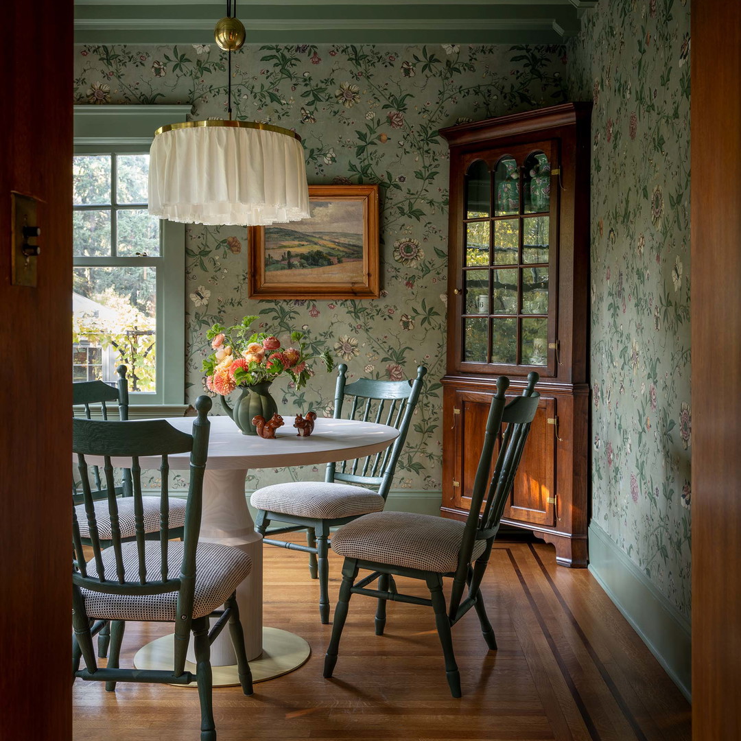 a dining room with a table and chairs