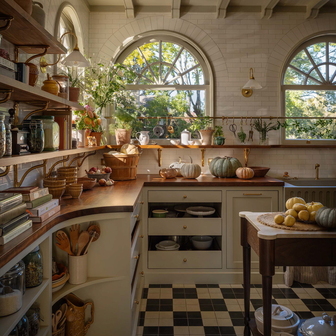 a kitchen with a black and white checkered floor