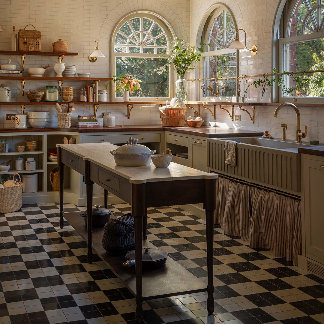 a kitchen with a checkered floor and a large window