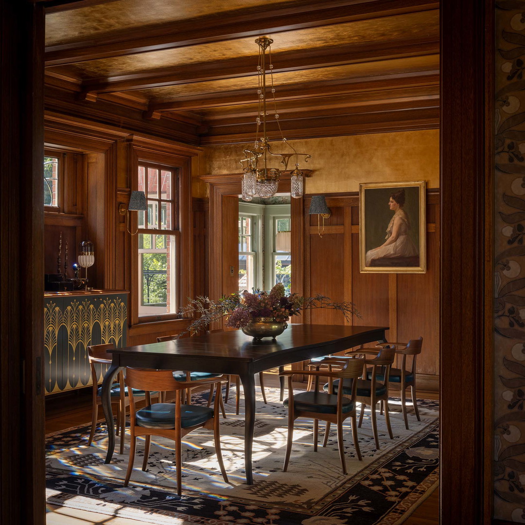 a dining room with a table and chairs