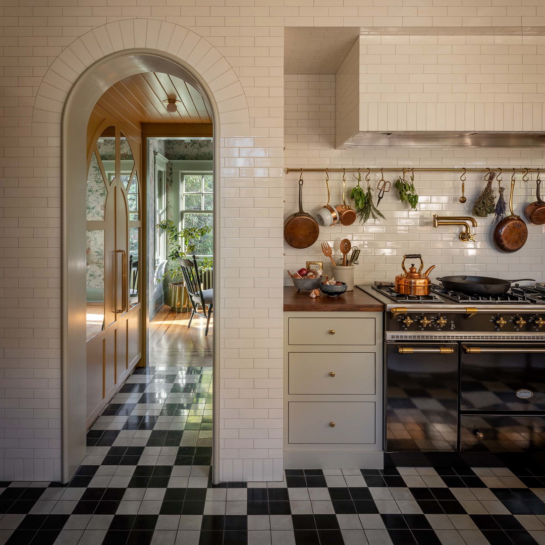 a kitchen with a black and white checkered floor