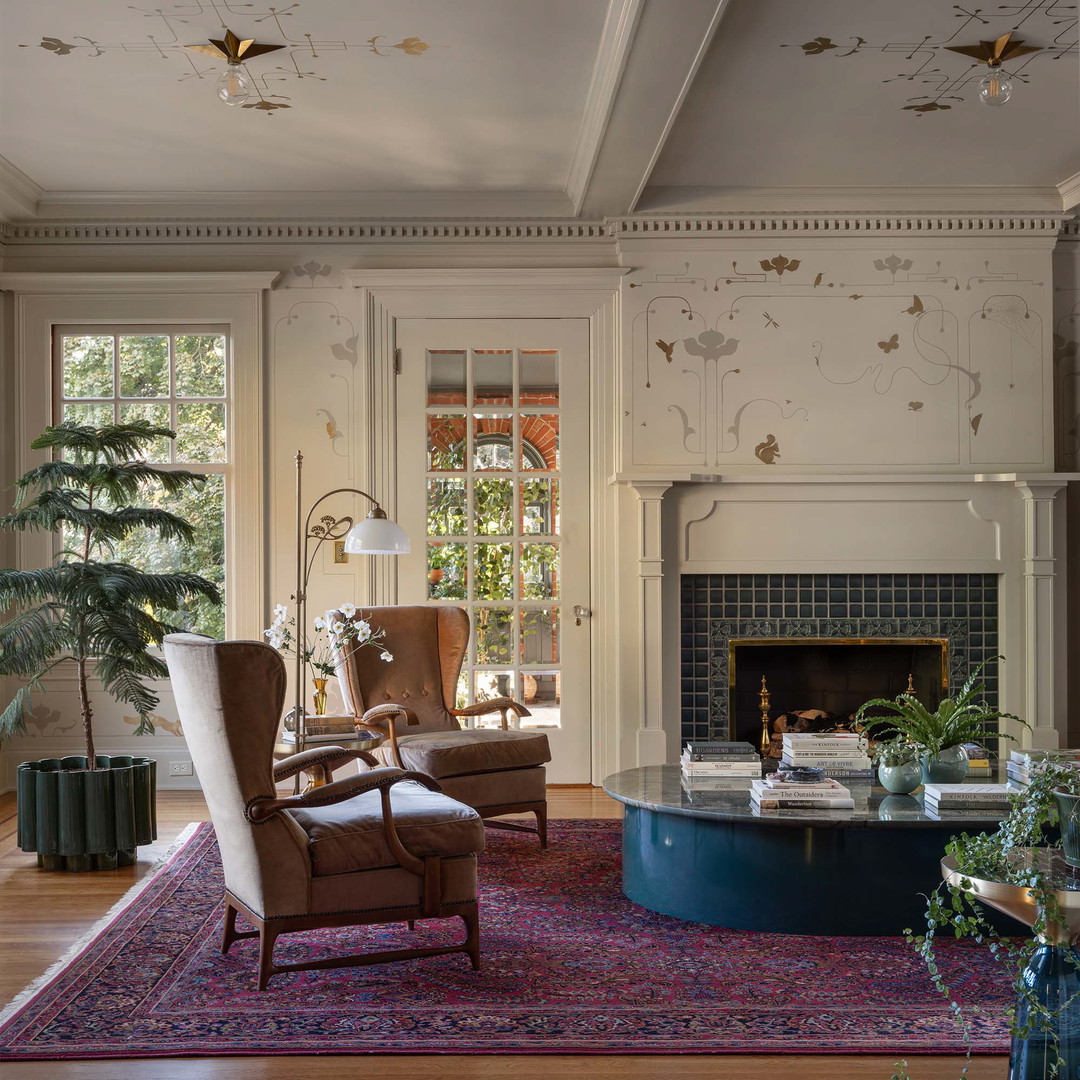 a living room filled with furniture and a fire place