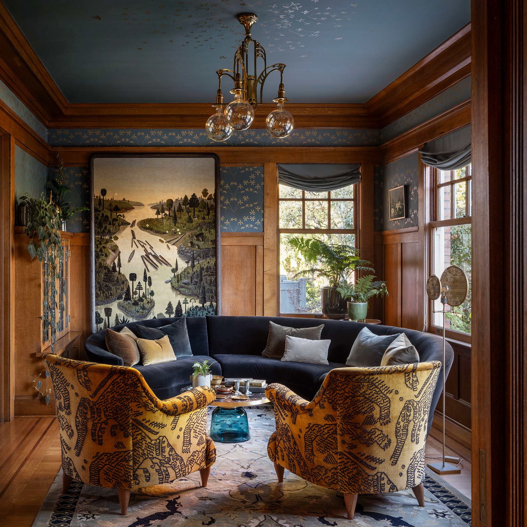 a living room filled with furniture and a chandelier