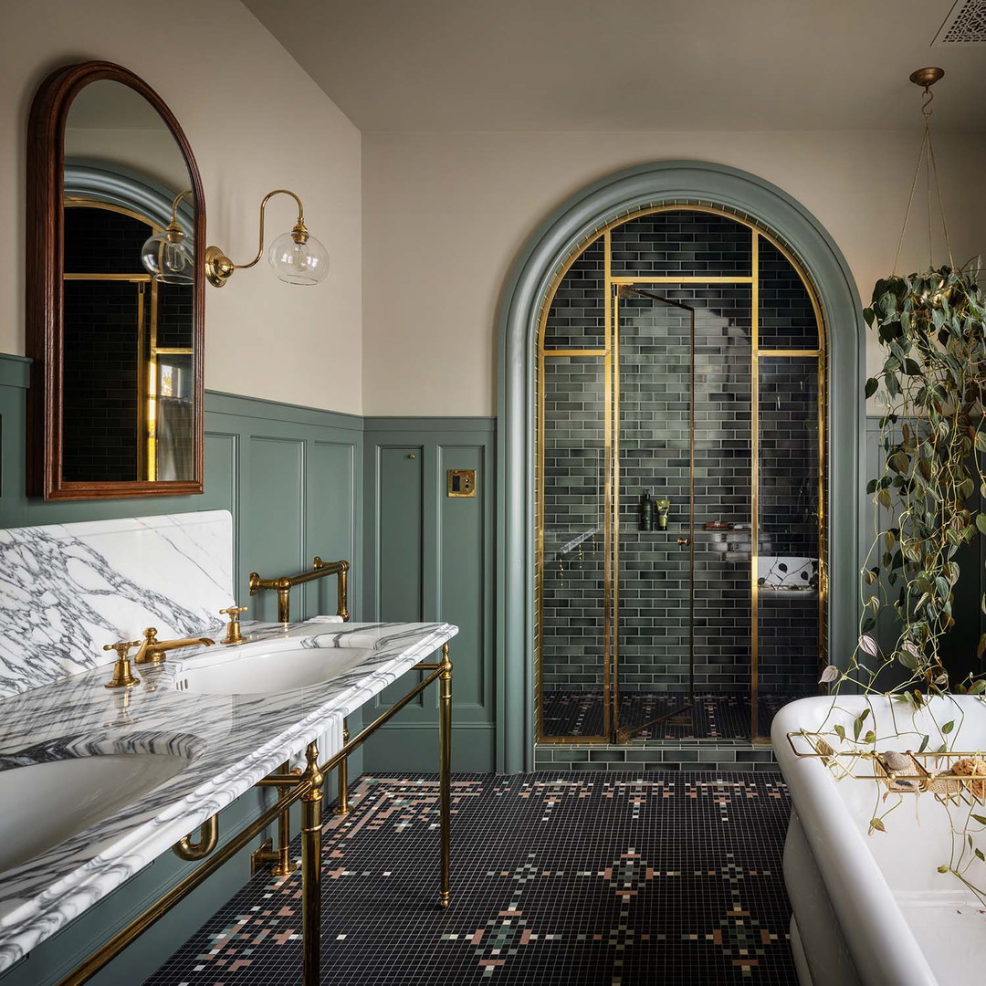 a bath room with a bath tub a sink and a mirror