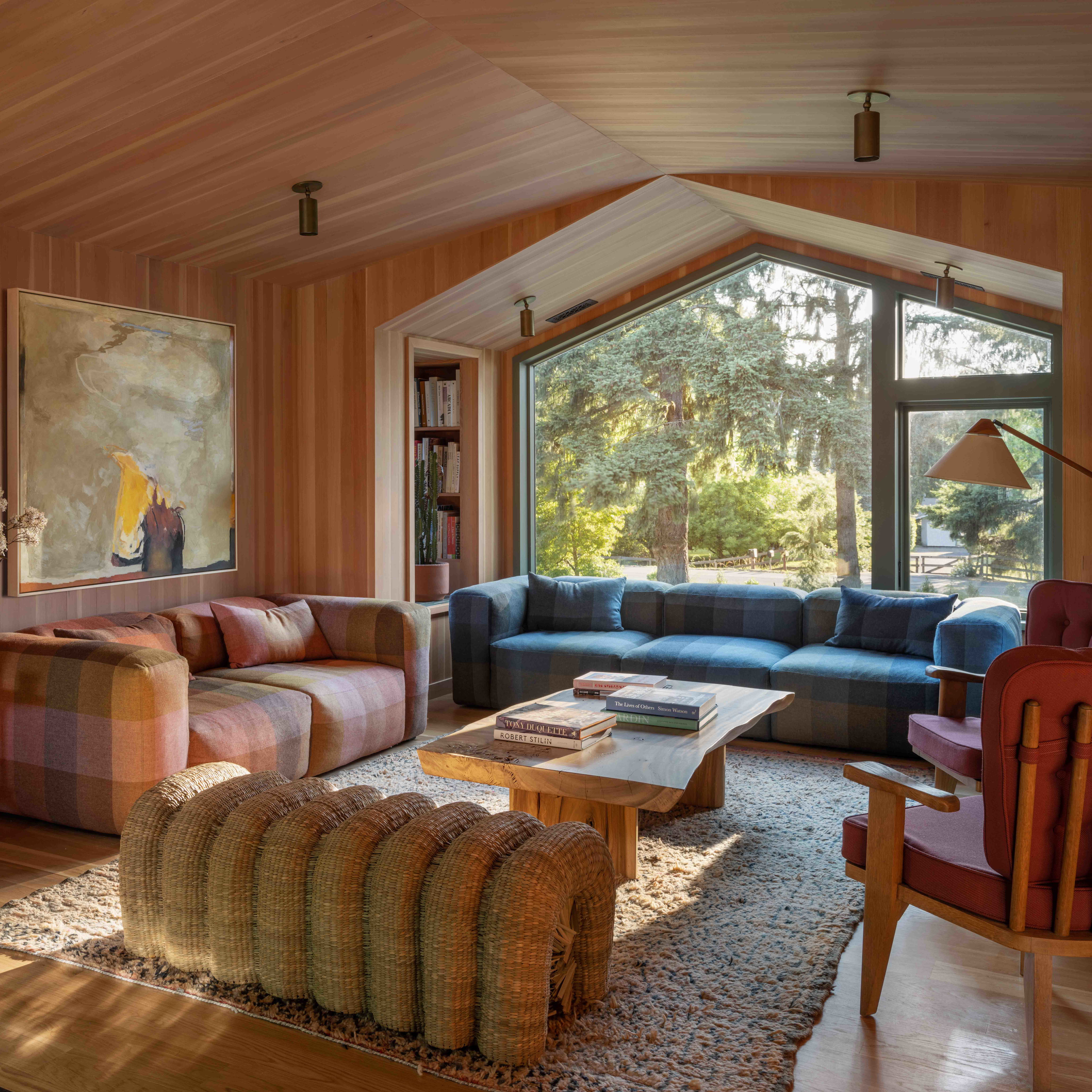 a living room filled with furniture and a large window