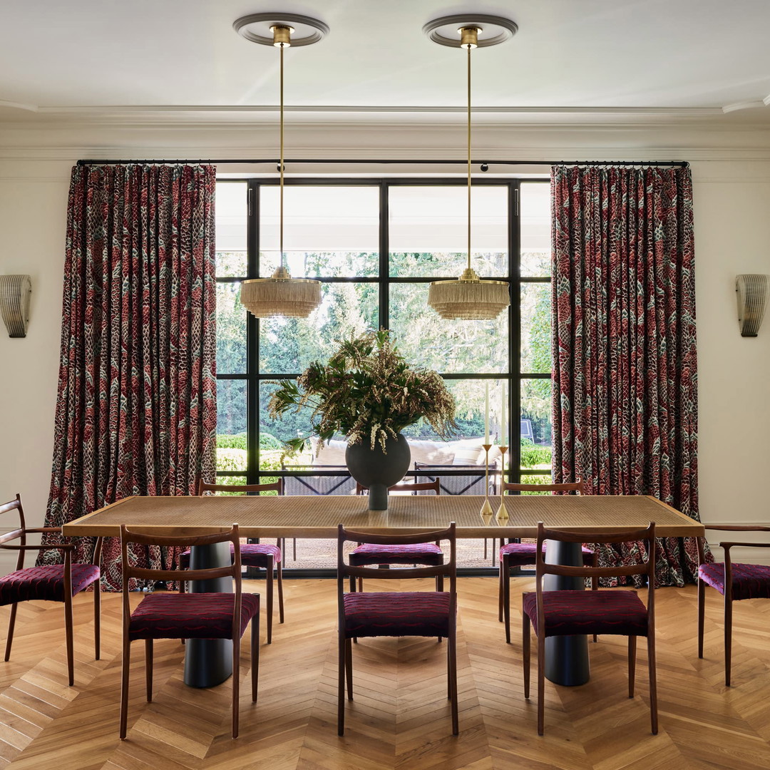 a dining room with a table and chairs