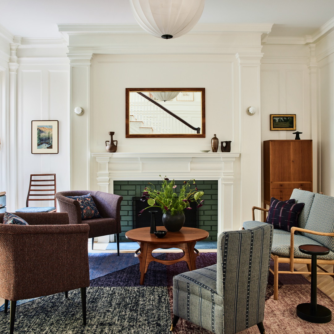 a living room filled with furniture and a fire place