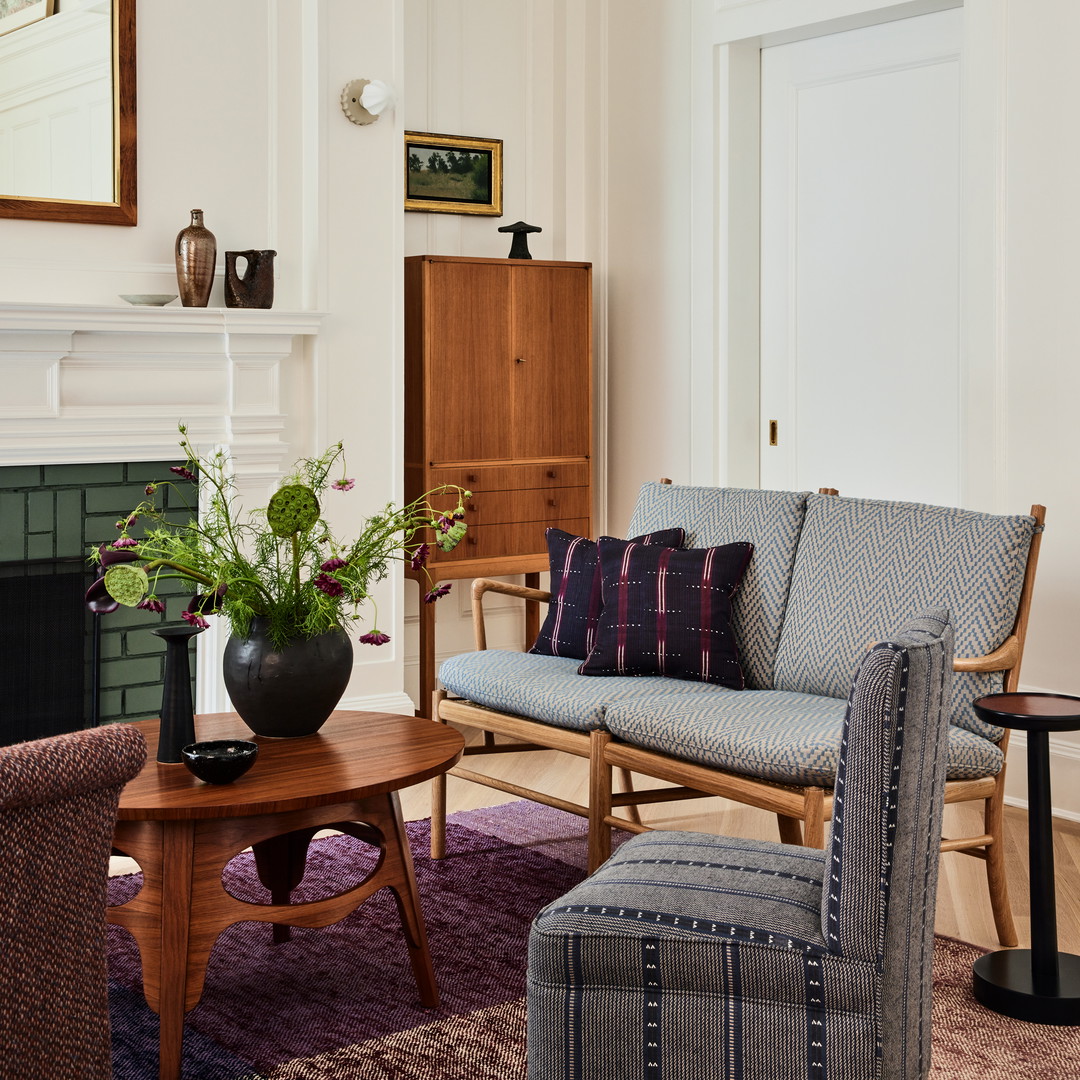 a living room filled with furniture and a fire place