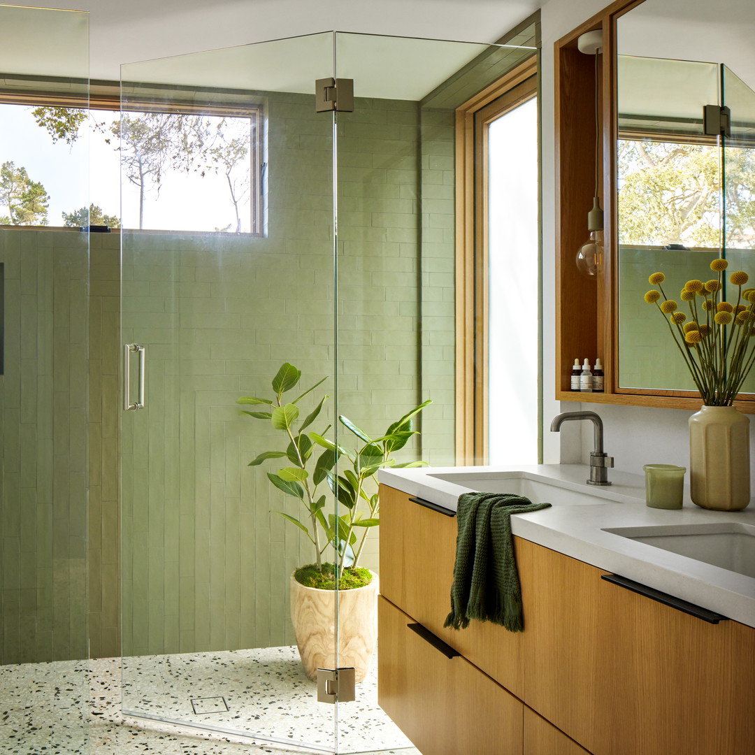 a bathroom with a shower and a sink