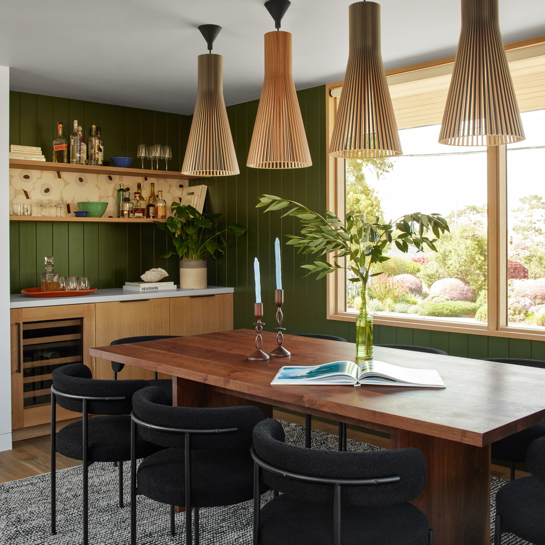 a dining room with a table and chairs