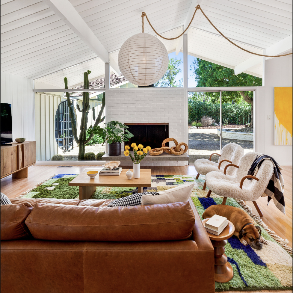 a living room filled with furniture and a fire place