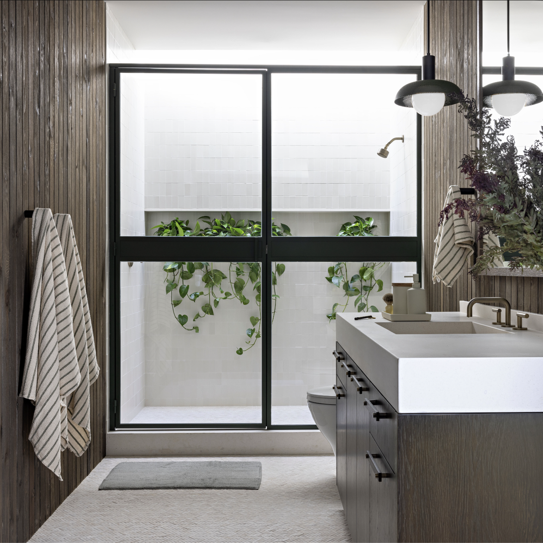 a bathroom with a large window and a sink