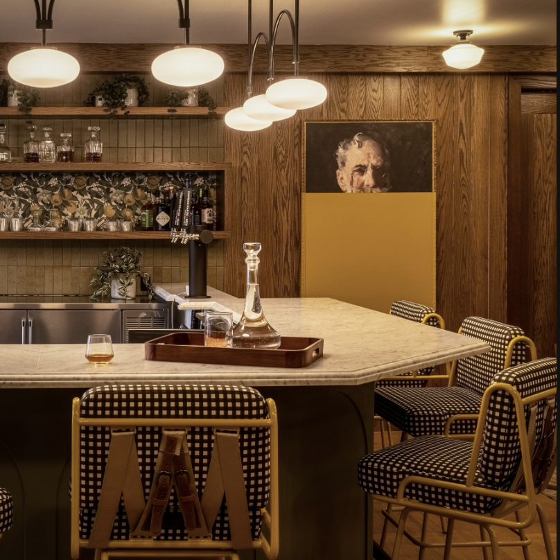 a kitchen with a center island surrounded by bar stools