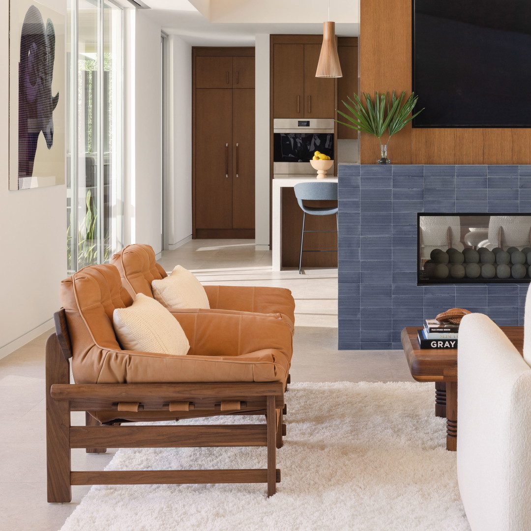 a living room filled with furniture and a flat screen tv