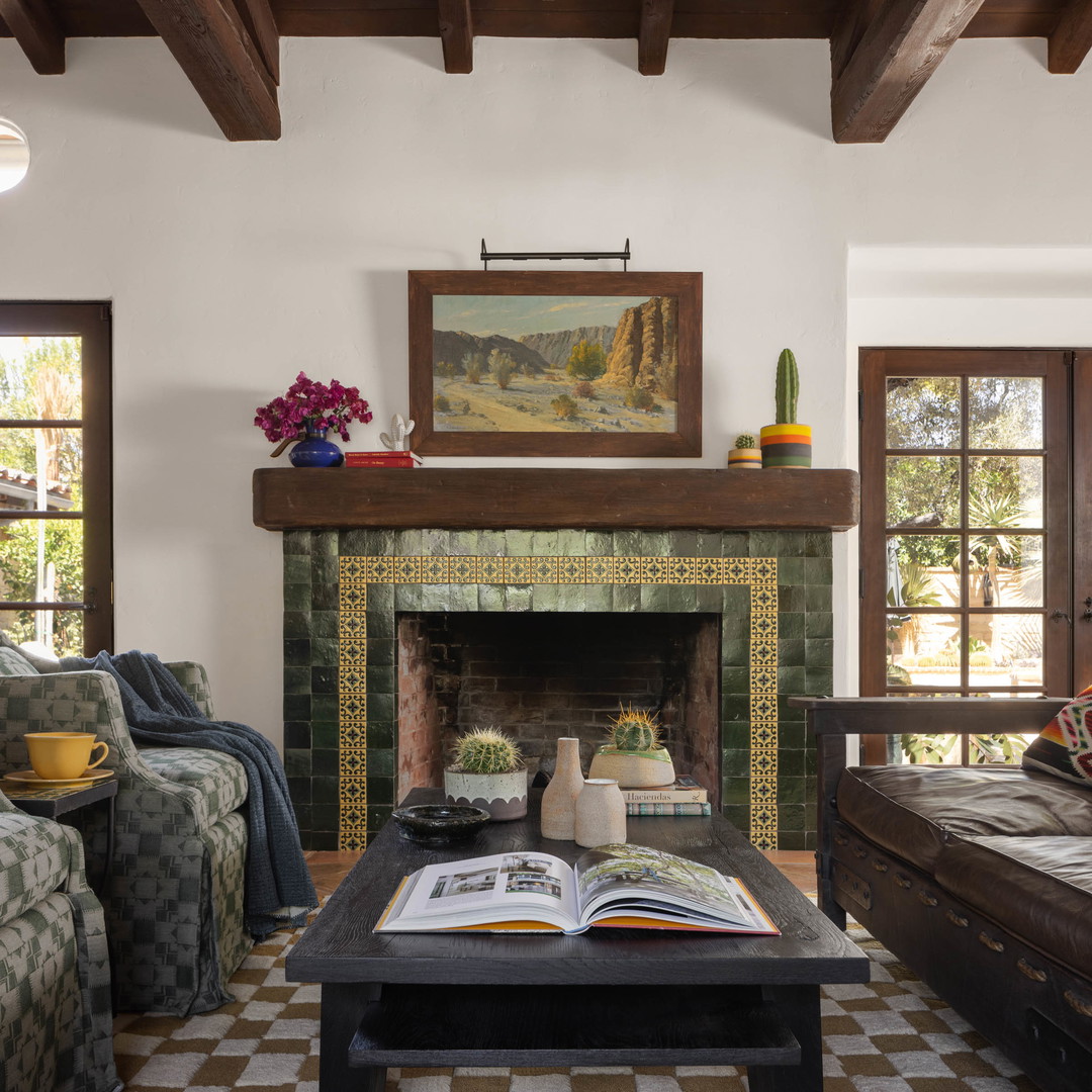 a living room filled with furniture and a fire place