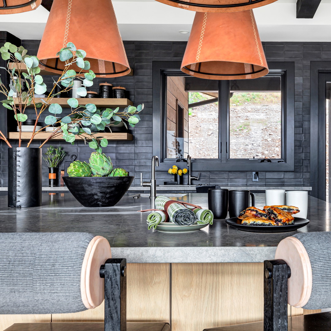 a kitchen with a large center island with a bowl of food on it