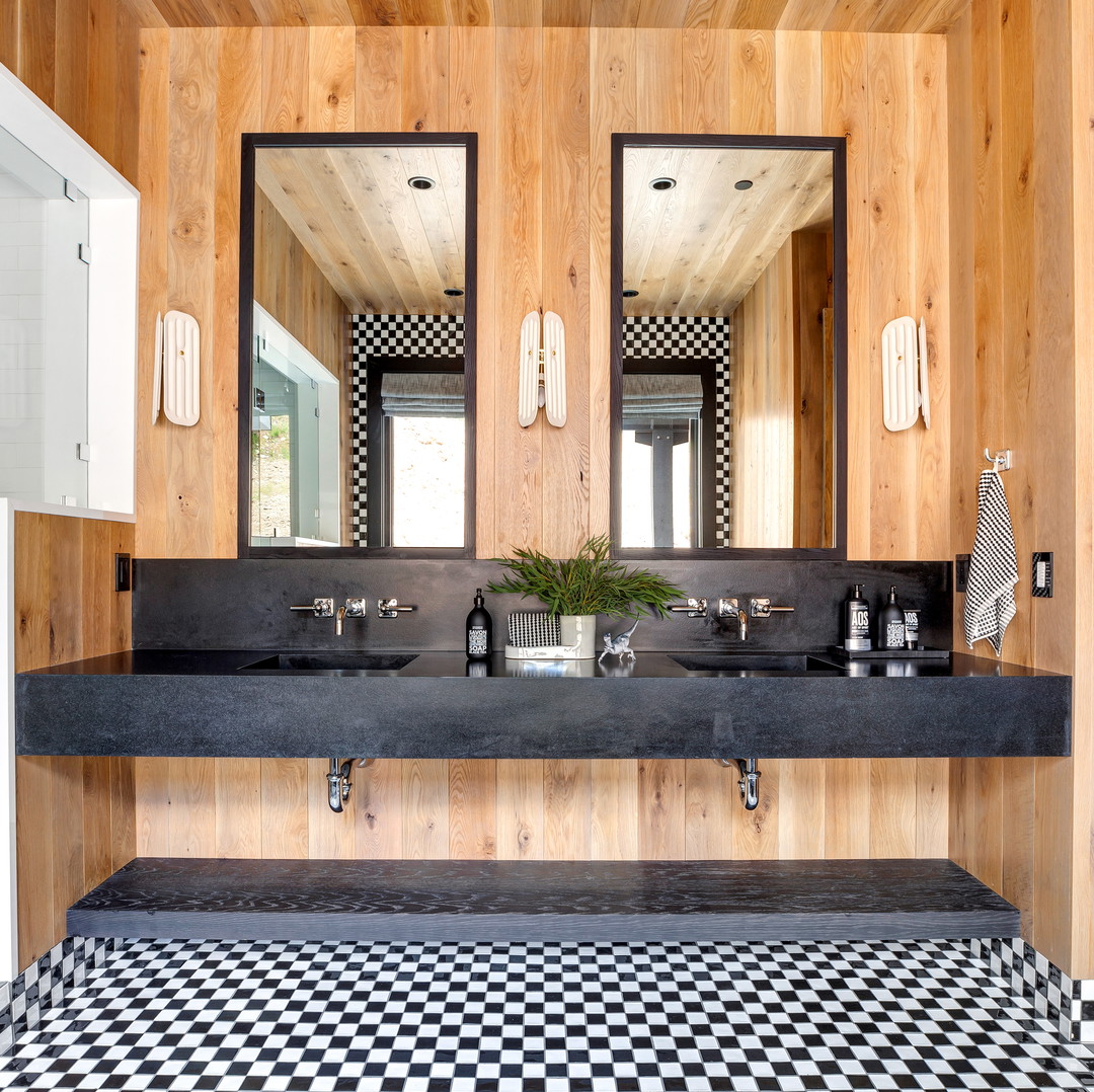 a black and white checkered floor in a bathroom