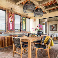 a dining room with a table and chairs