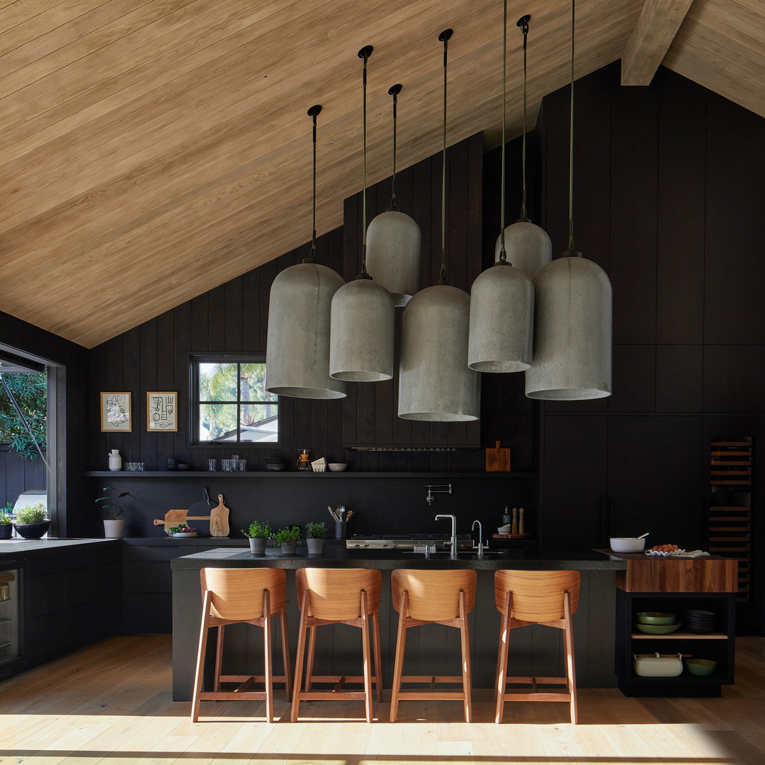 a kitchen with a lot of stools in it