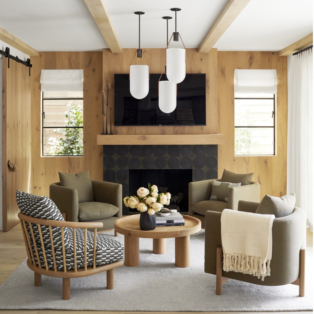 a living room filled with furniture and a fire place