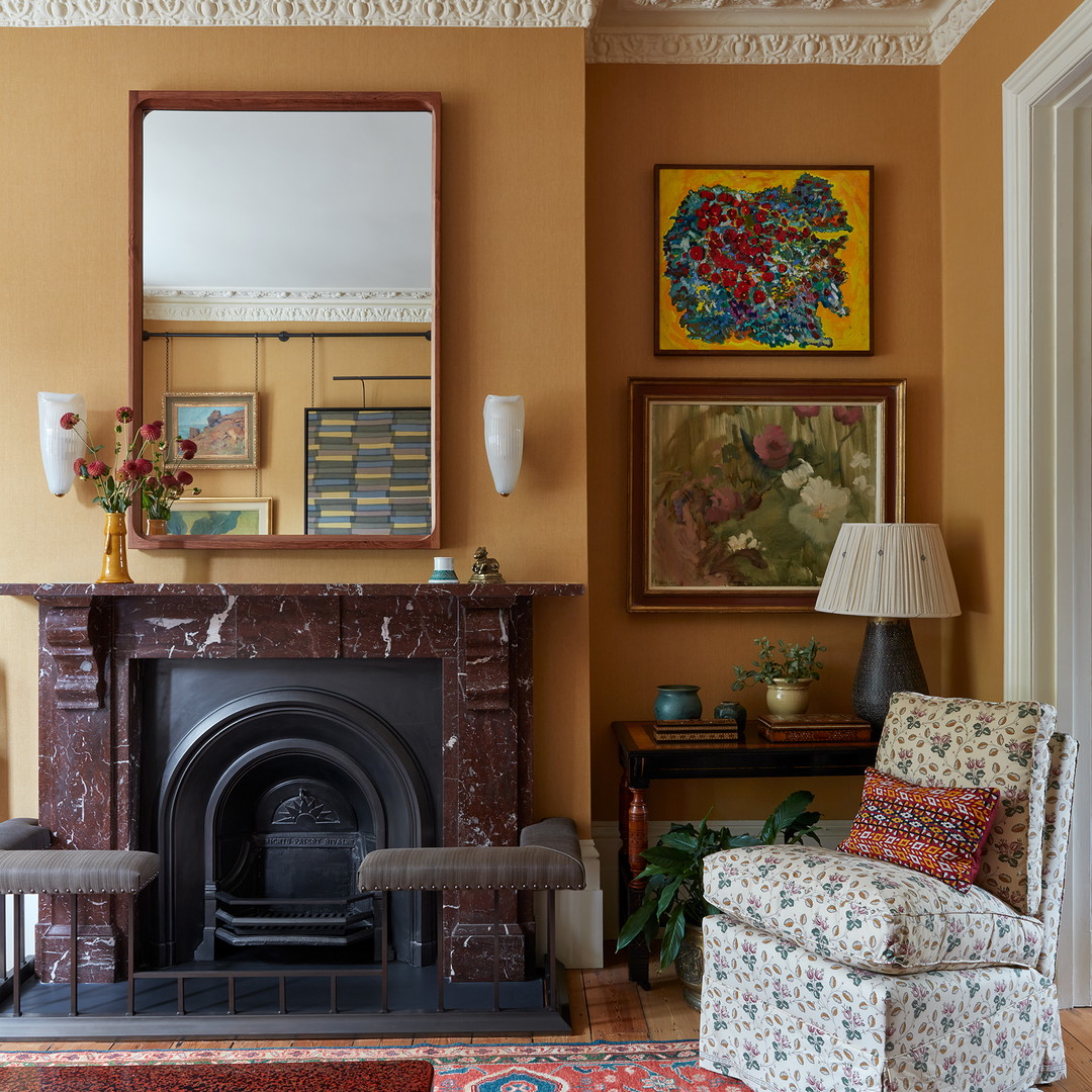 a living room filled with furniture and a fire place