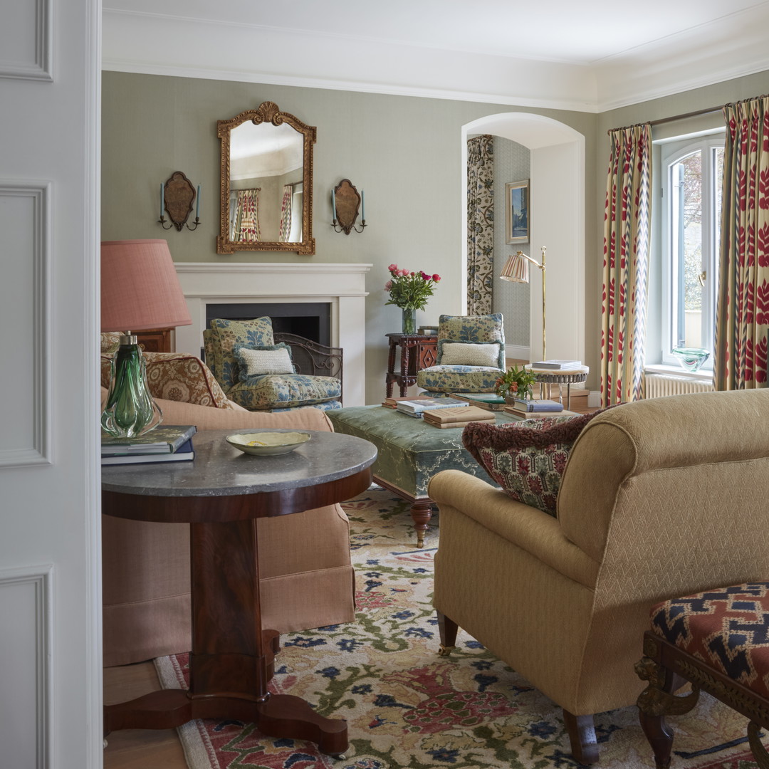 a living room filled with furniture and a fire place