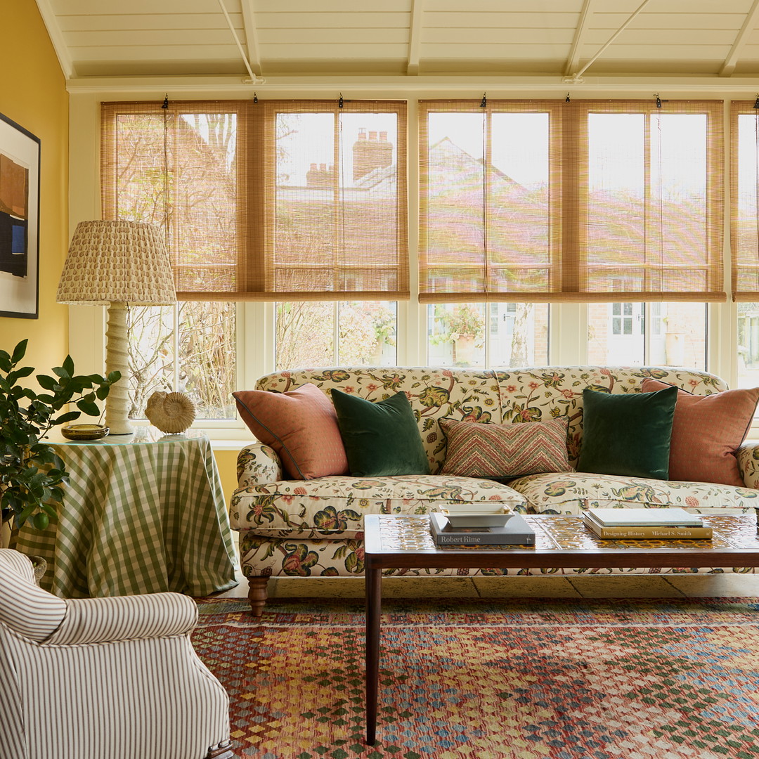 a living room filled with furniture and a chandelier