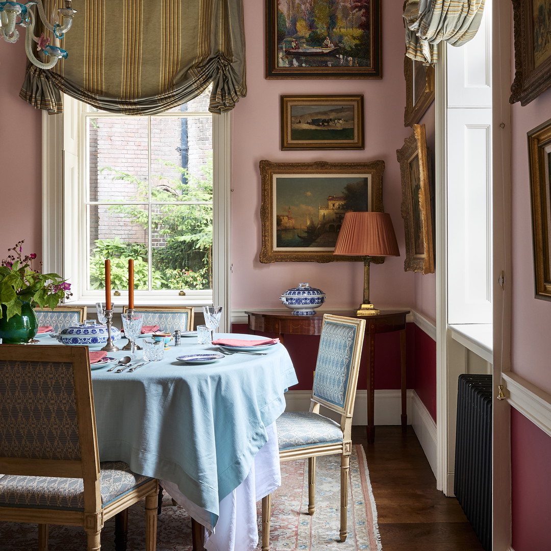 a dining room with a table and chairs