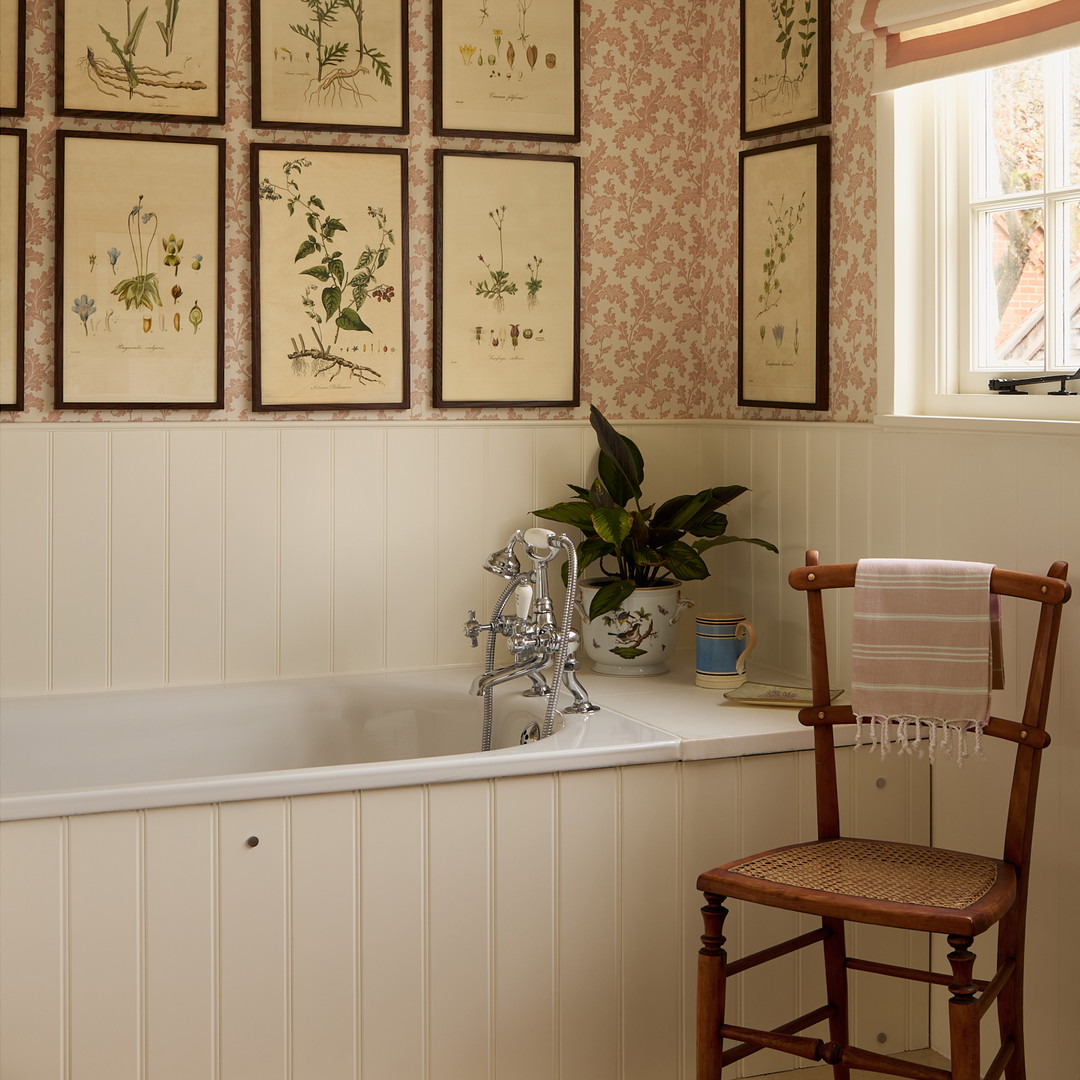 a bathroom with a chair and a bathtub