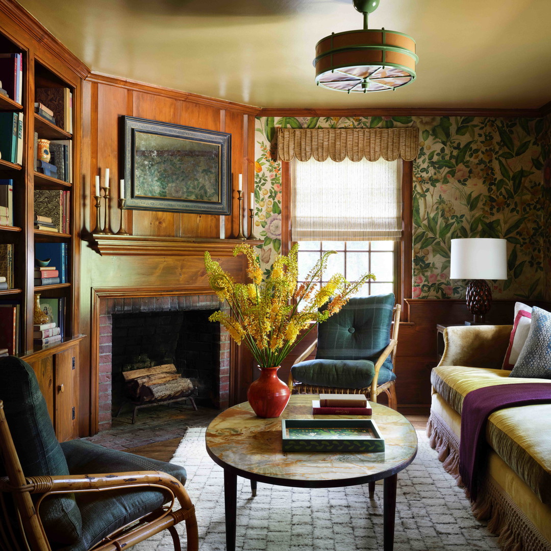 a living room filled with furniture and a fire place