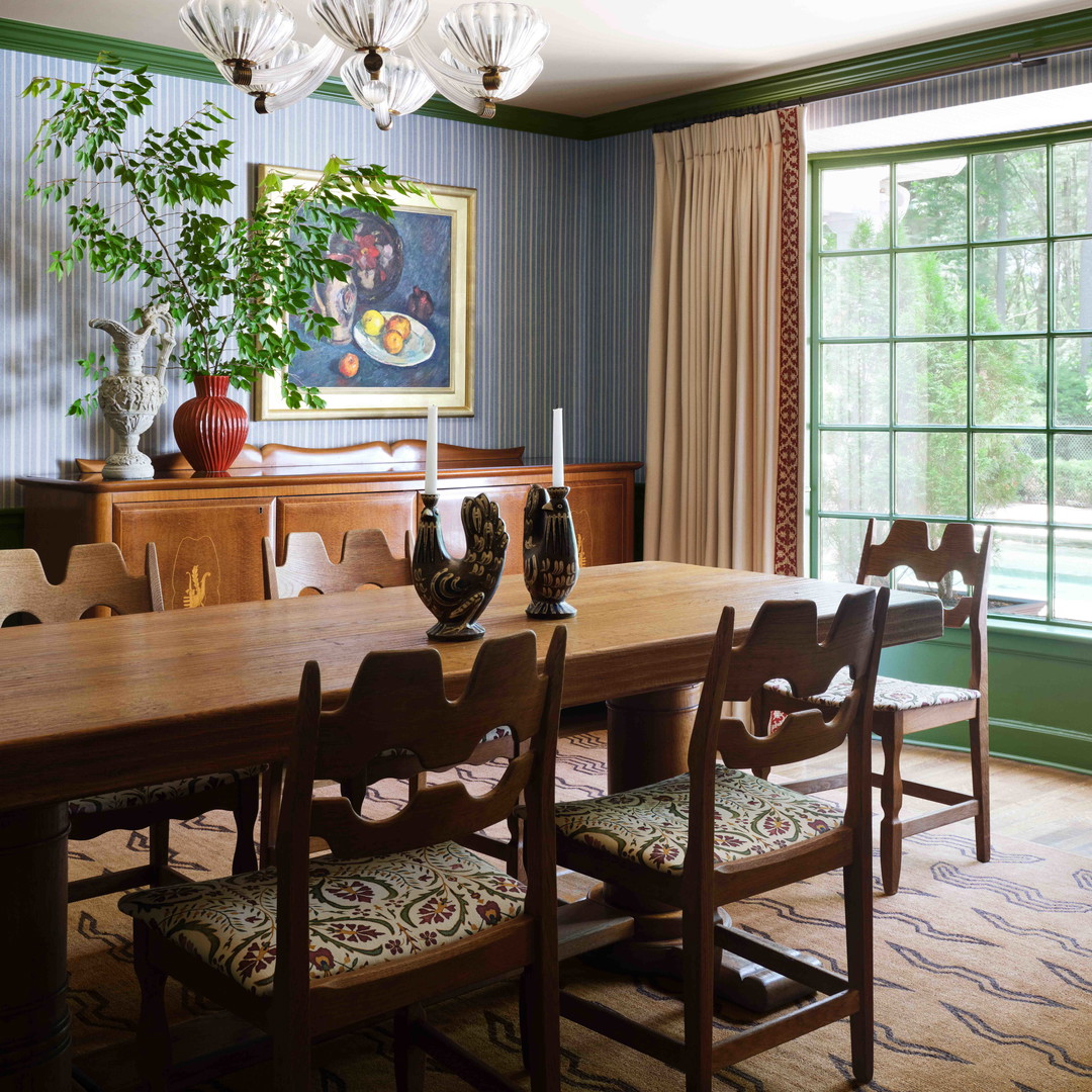 a dining room with a table and chairs