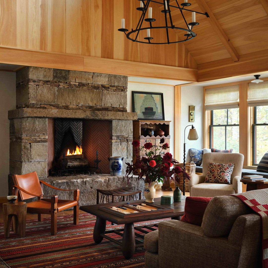 a living room filled with furniture and a fire place