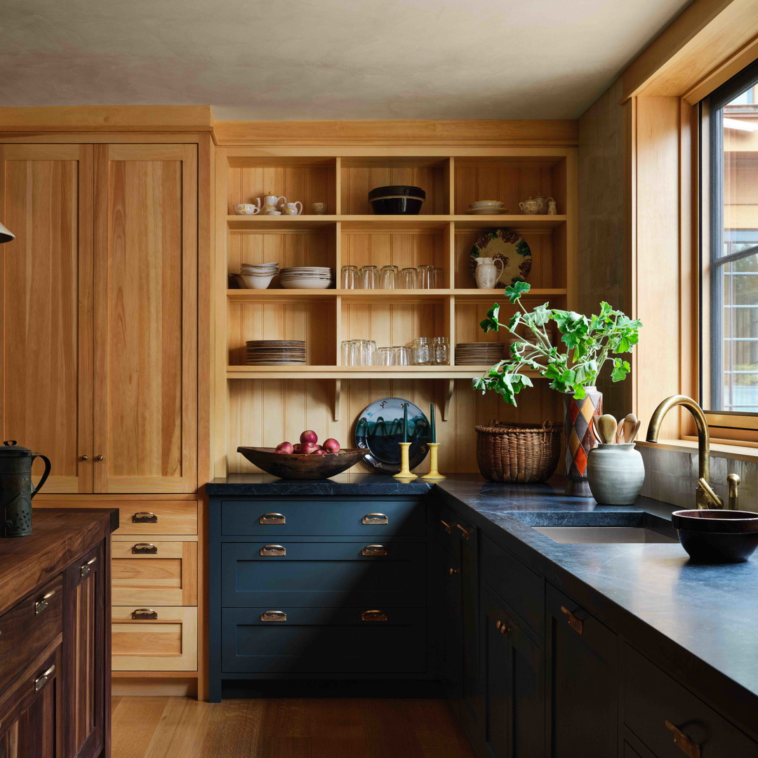 a kitchen filled with lots of wooden cabinets