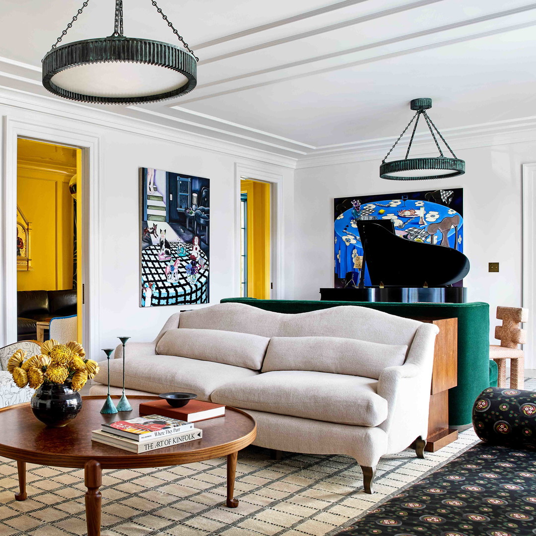 a living room filled with furniture and a piano