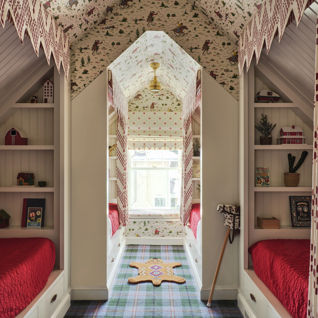 a room with two beds and a rug on the floor